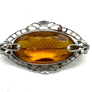 Oval Topaz colored brooch